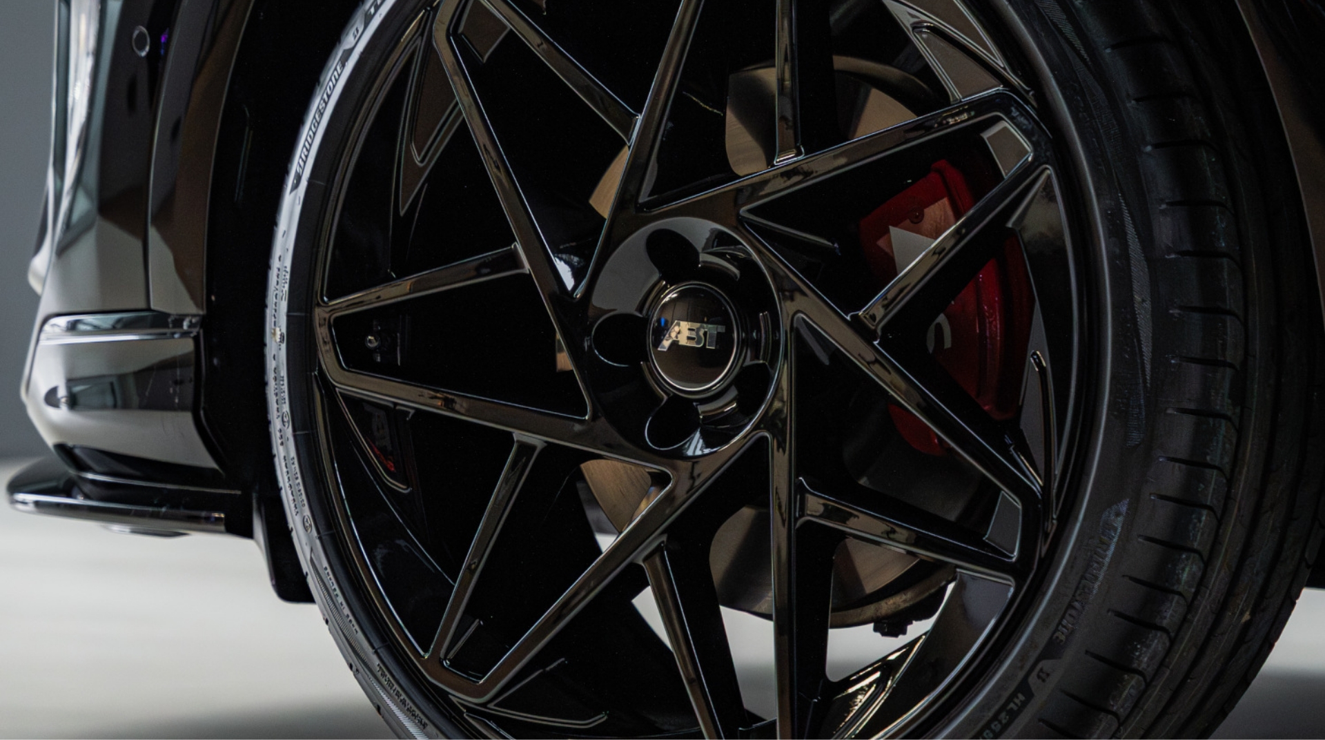 abt-services-sport-wheels Close-up of black ABT Sportsline alloy wheel and red brake caliper