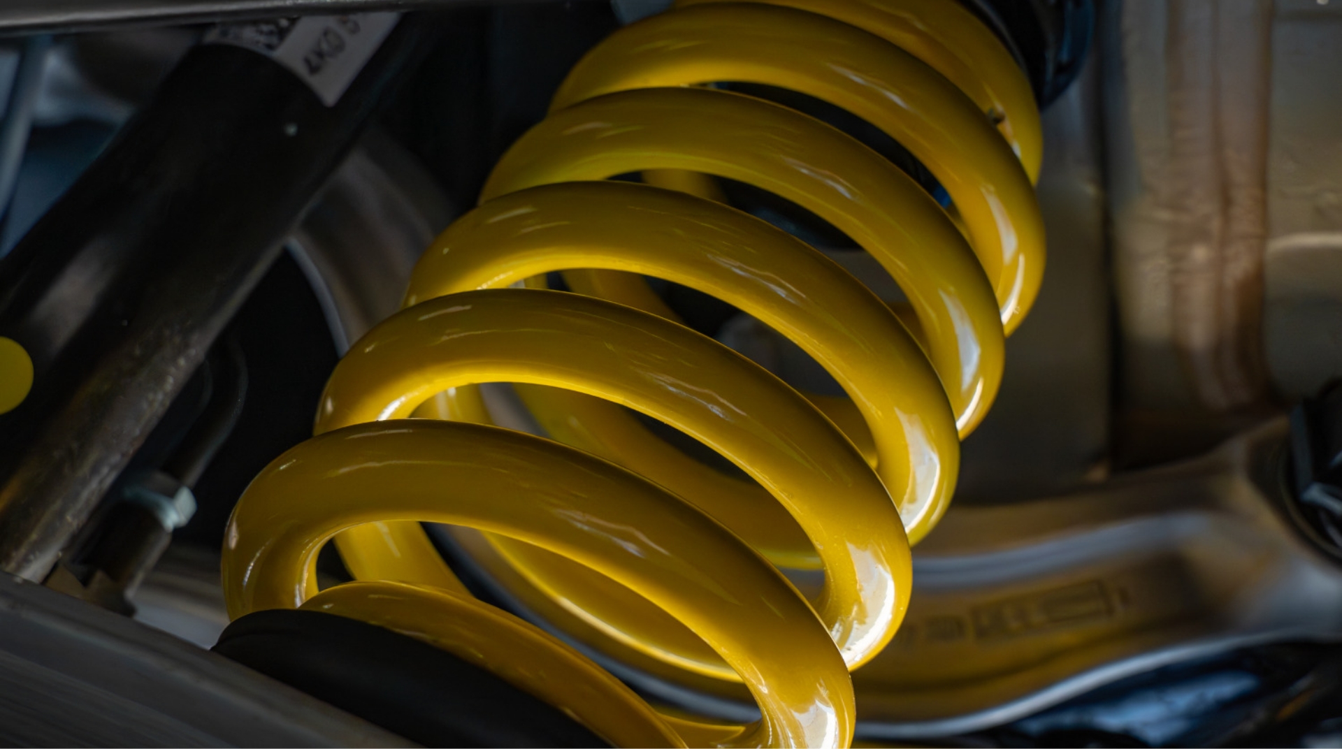 abt-services-suspension Close-up of yellow ABT sport suspension spring and damper